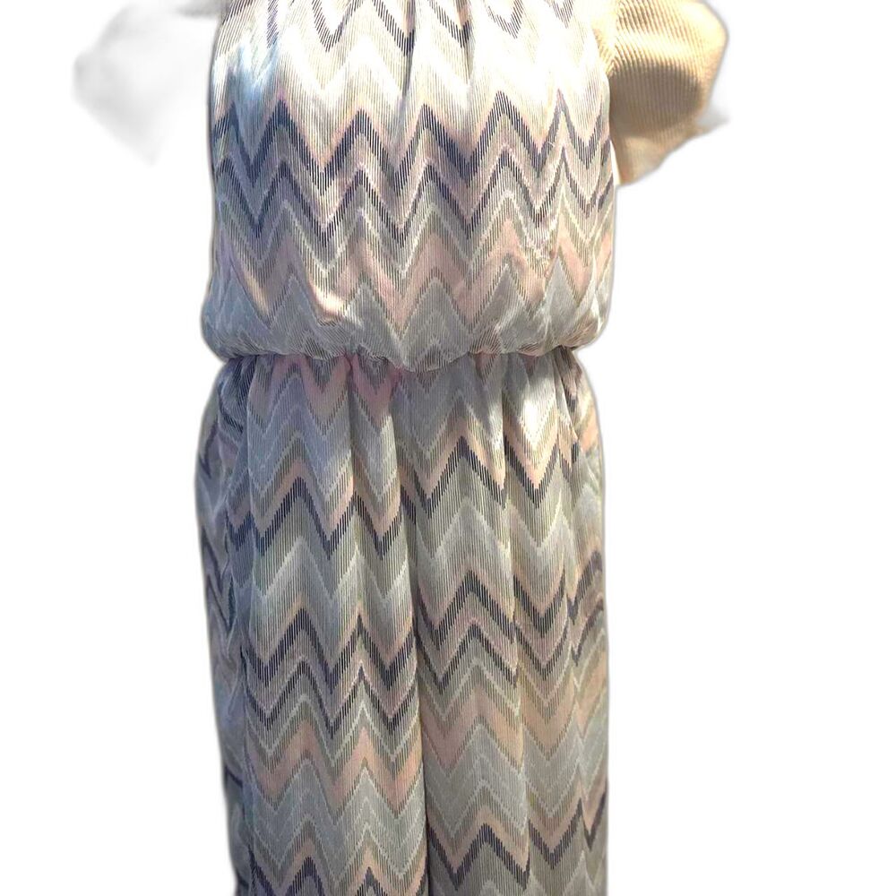 Jumpsuit by Tacera with a pink, gray, white, and mint abstract chevron pattern